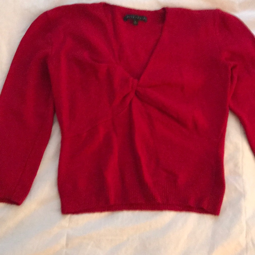 Red Bette Paige sweater.  Forms to body
